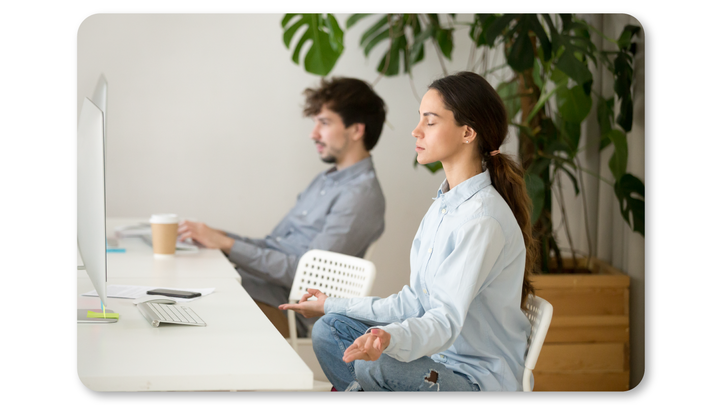 A Woman Practicing Mindfulness Exercises at Work through Mindful Body Scan