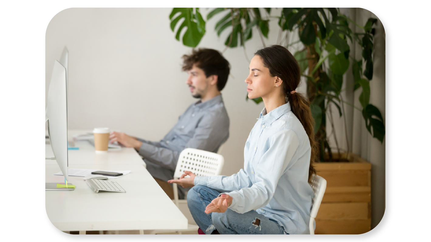 Employees practising wellness activies at work